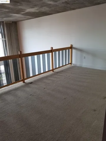 a view of a chandelier fan and wooden floor