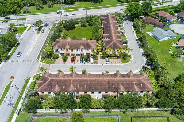 an aerial view of a house with a garden