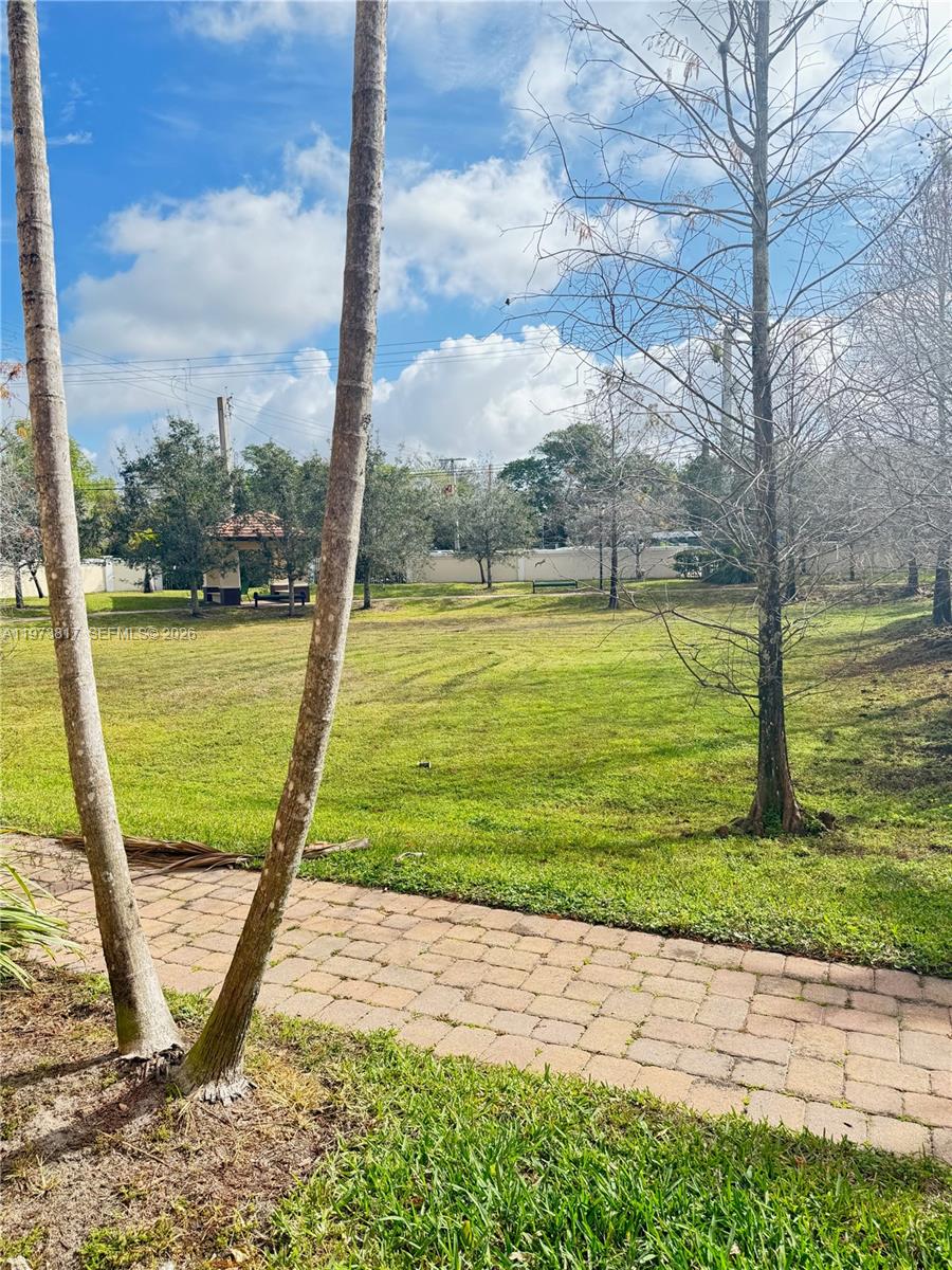 7658 Northwest 88th Terrace, Unit 12 Tamarac, FL 33321 - Photo 5 of 12 a view of a swimming pool with a ocean view