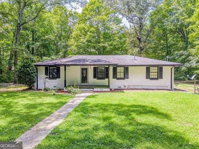 195 Old Shannon Road Northeast Rome, GA 30161 - Photo 1 of 1 a front view of a house with a garden