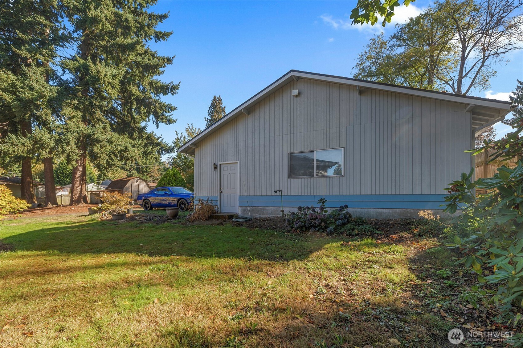 1027 South 112th Street Seattle, WA 98168 - Photo 24 of 33 a view of a house with backyard and sitting area