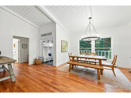 a living room with furniture a window and a chandelier