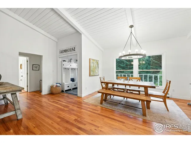 a living room with furniture a window and a chandelier