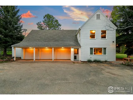 a view of an house with backyard space and sitting area