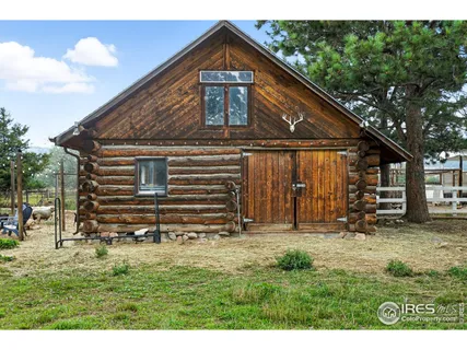 a front view of house with a garden