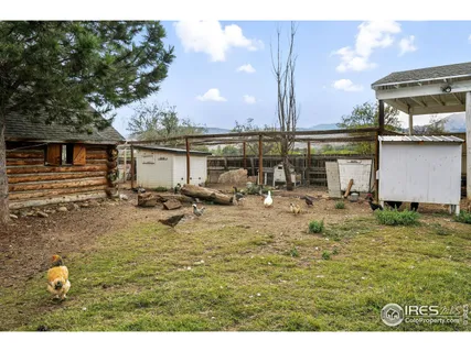 a view of a backyard with sitting area
