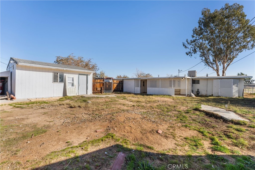 13445 Fran Street Edwards, CA 93523 - Photo 12 of 27 a front view of a house with a yard