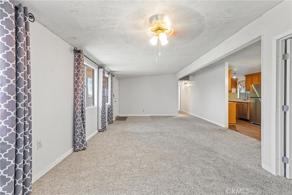 13445 Fran Street Edwards, CA 93523 - Photo 14 of 27 a view of an empty room and a kitchen