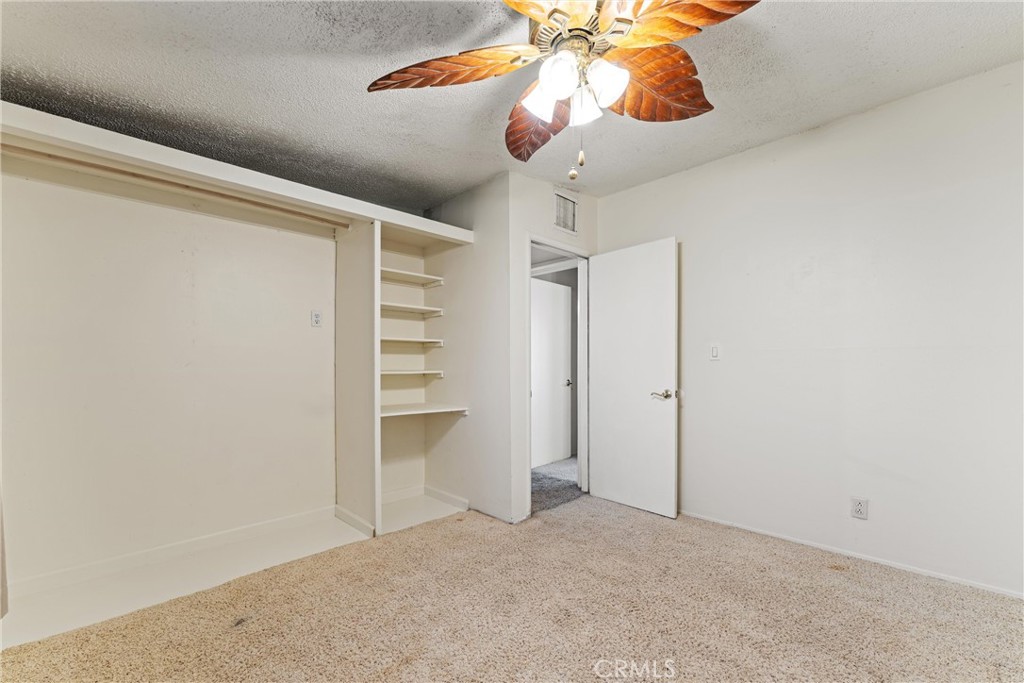 13445 Fran Street Edwards, CA 93523 - Photo 18 of 27 a view of a room with a ceiling fan and window