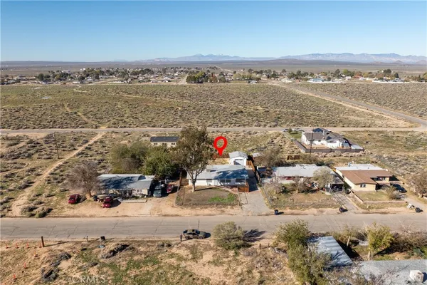 a buildings covered with tall trees