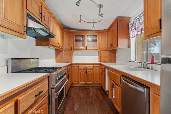 a view of an empty room with a ceiling fan and bathroom
