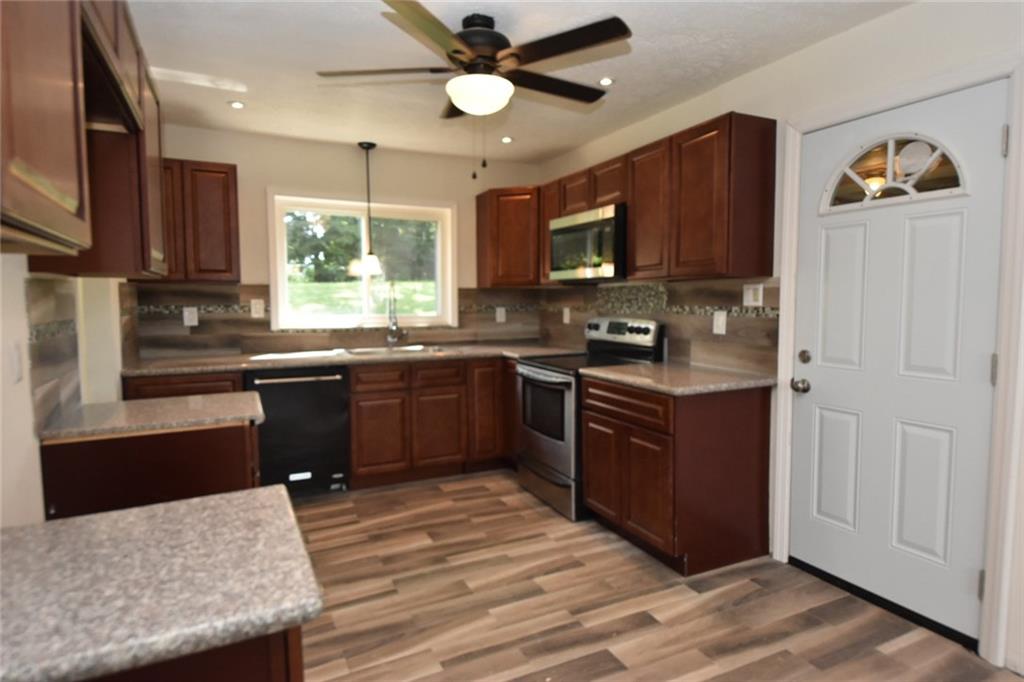 241 Alameda Road Butler, PA 16001 - Photo 2 of 24 The large eat-in kitchen has granite counter tops and newly installed cabinets. The door to the breezeway is newly installed as well.