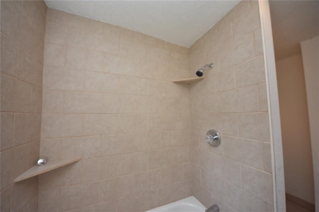 241 Alameda Road Butler, PA 16001 - Photo 11 of 24 New ceramic tile surround with shelving.