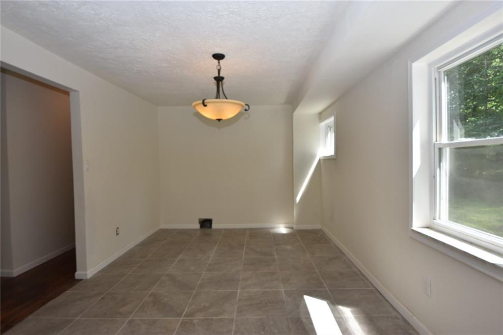 241 Alameda Road Butler, PA 16001 - Photo 15 of 24 Ceramic tiled flooring in the spacious dining area. Updated and modern lighting has been installed.