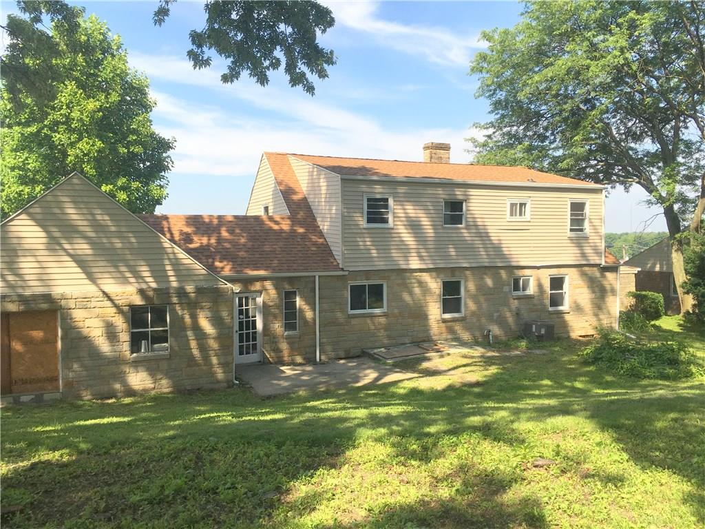 241 Alameda Road Butler, PA 16001 - Photo 19 of 24 Exterior rear view of the home. Lot is over 1/2 acre. The home has a cut stone main floor and wood framed upper floor. Gutters and downspouts were recently installed.