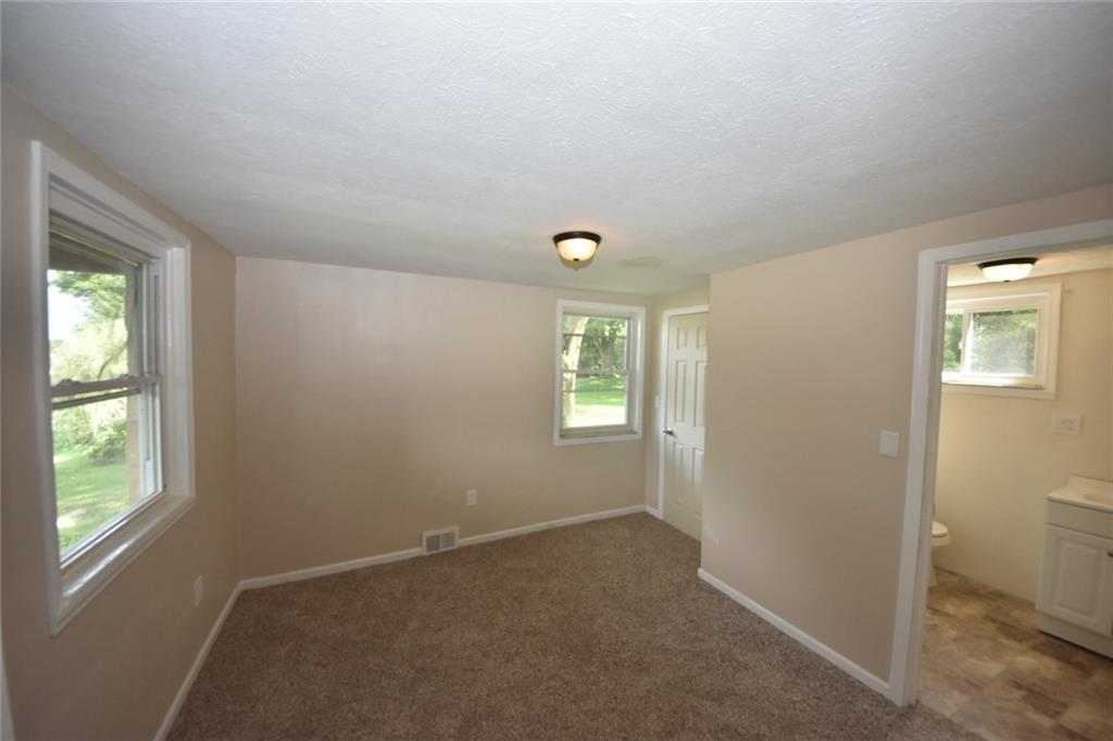 241 Alameda Road Butler, PA 16001 - Photo 21 of 24 In-law suite bedroom is positioned off the main floor living room and has it's own full bath.