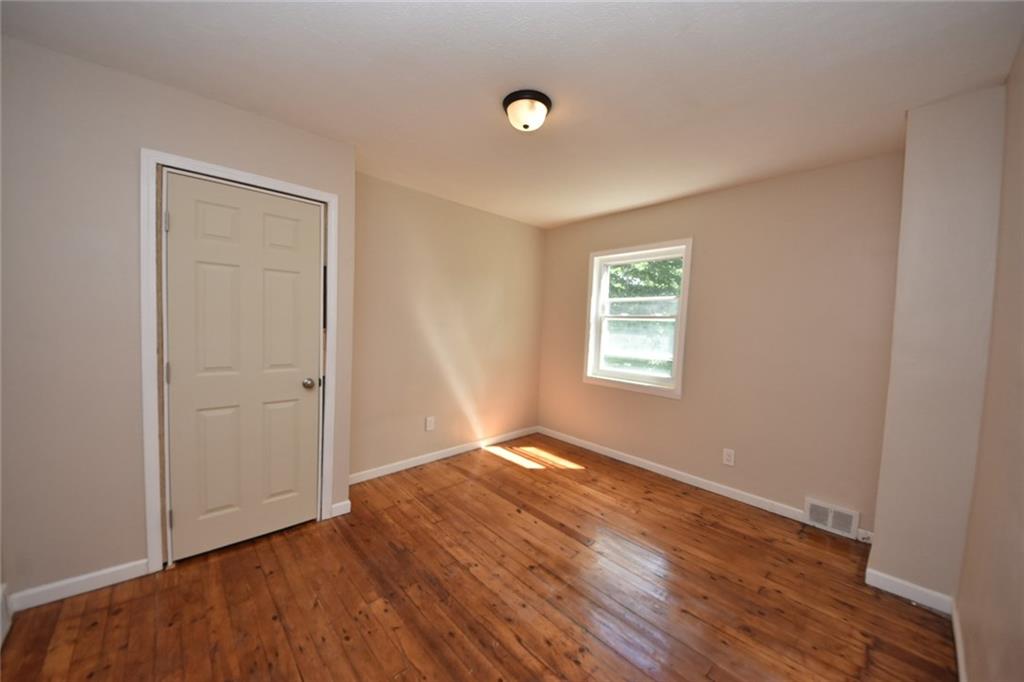 241 Alameda Road Butler, PA 16001 - Photo 6 of 24 Second floor bedroom is newly dry-walled and painted. It also has wood floors. The closet door needs some final fit and finish work.
