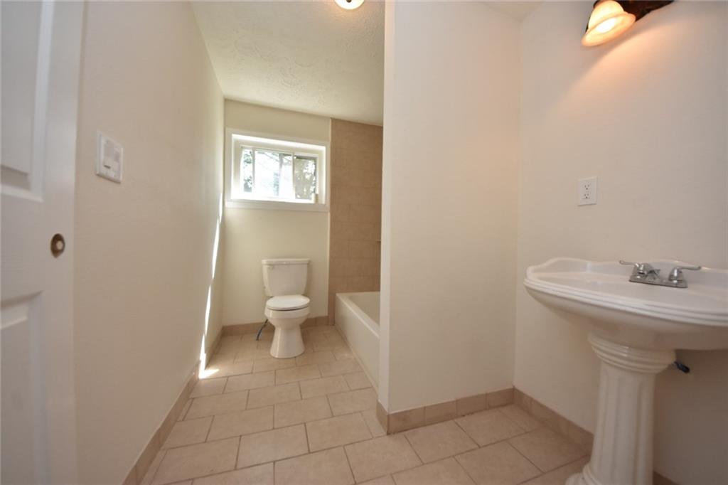241 Alameda Road Butler, PA 16001 - Photo 10 of 24 Upper floor bathroom has new fixtures. The ceramic surround shower is new. Room measures 9' x 6' .