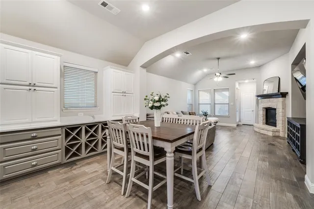 a view of a dining room with furniture and wooden floor