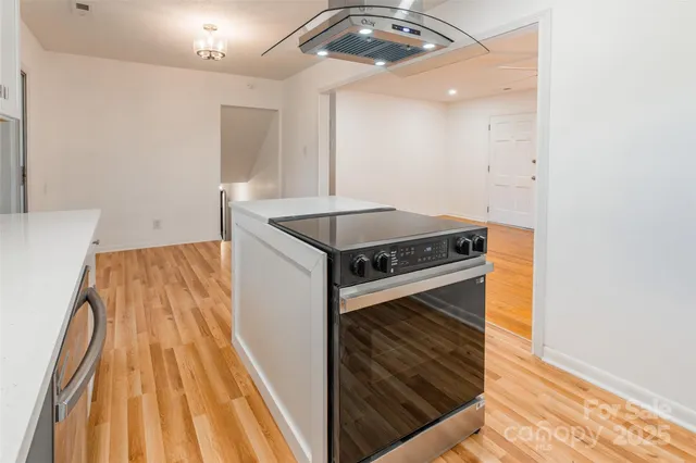 a kitchen with a stove and a microwave