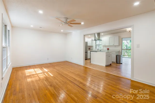 a view of a kitchen with a sink and a stove top oven