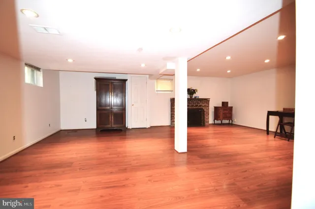 a view of a kitchen with a sink and a window
