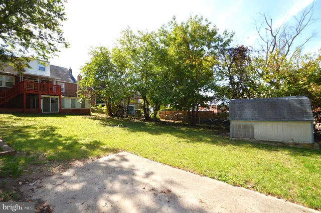 a view of an empty room with a kitchen