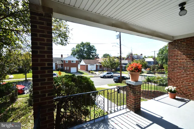 a view of a dining room with furniture and a flat screen tv