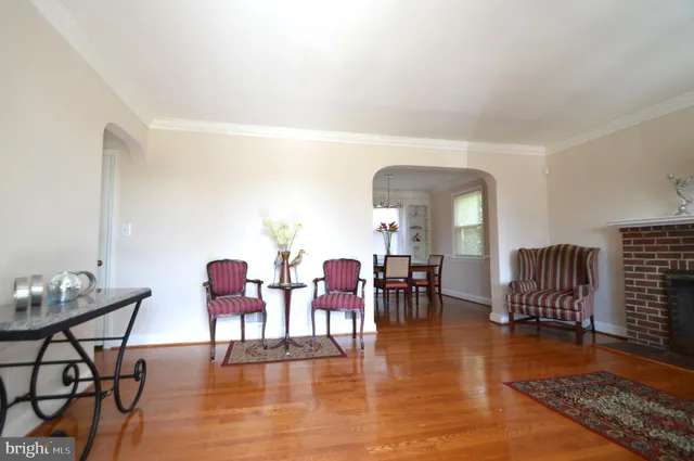 a backyard of a house with garden and outdoor seating