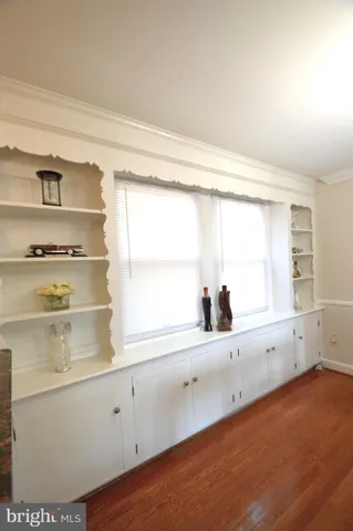 a bathroom with a sink mirror vanity and toilet