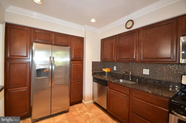 a bathroom with a toilet a sink and a shower curtain