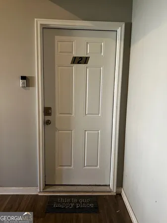 a view of backyard with swimming pool and seating space