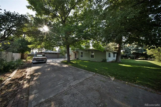 a view of a house with a back yard