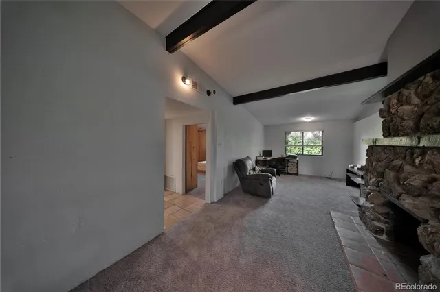 a view of a livingroom with furniture and a flat screen tv