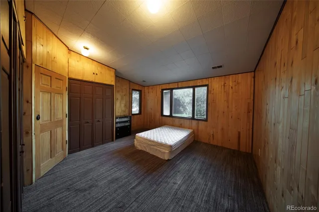 a view of hallway with windows and stairs