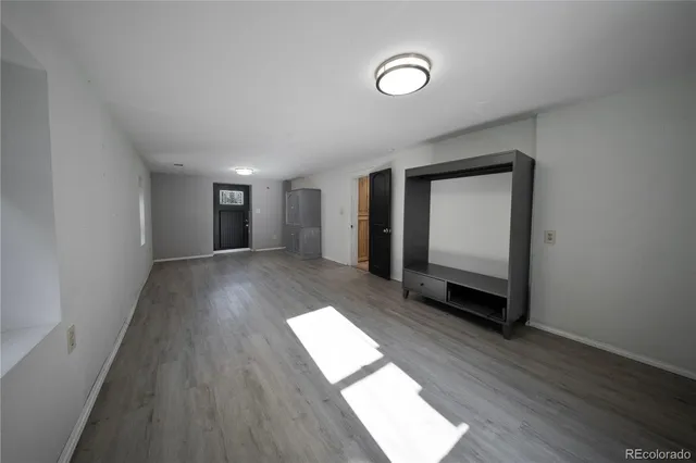 a view of entryway with wooden floor