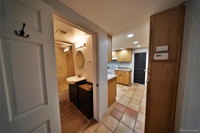 a view of a kitchen from the hallway