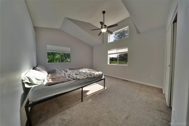 a living room with furniture a rug and a chandelier