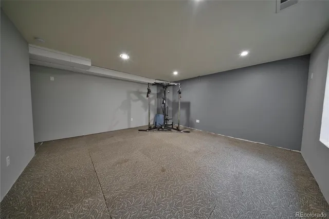 a view of a hall with wooden floor