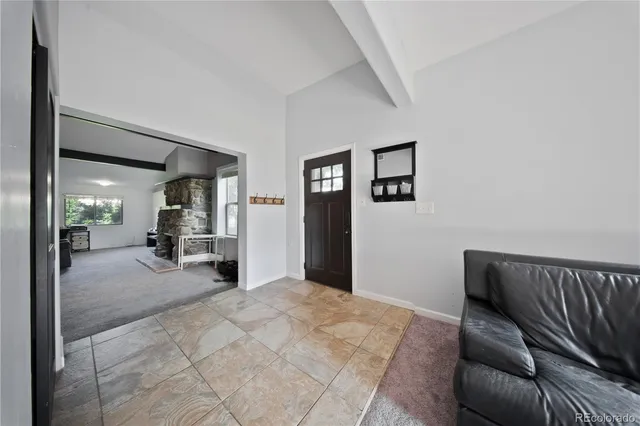 a view of a livingroom with couch and chair