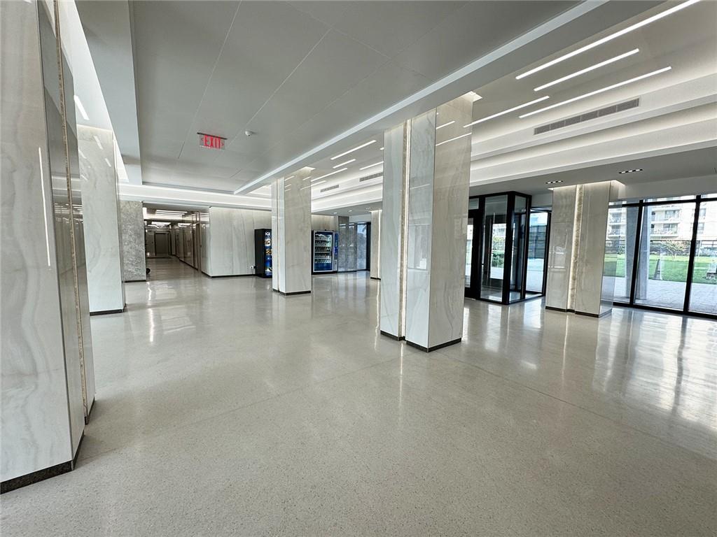 601 Surf Avenue, Unit 18E Brooklyn, NY 11224 - Photo 17 of 24 wooden floor in a hall with a living room