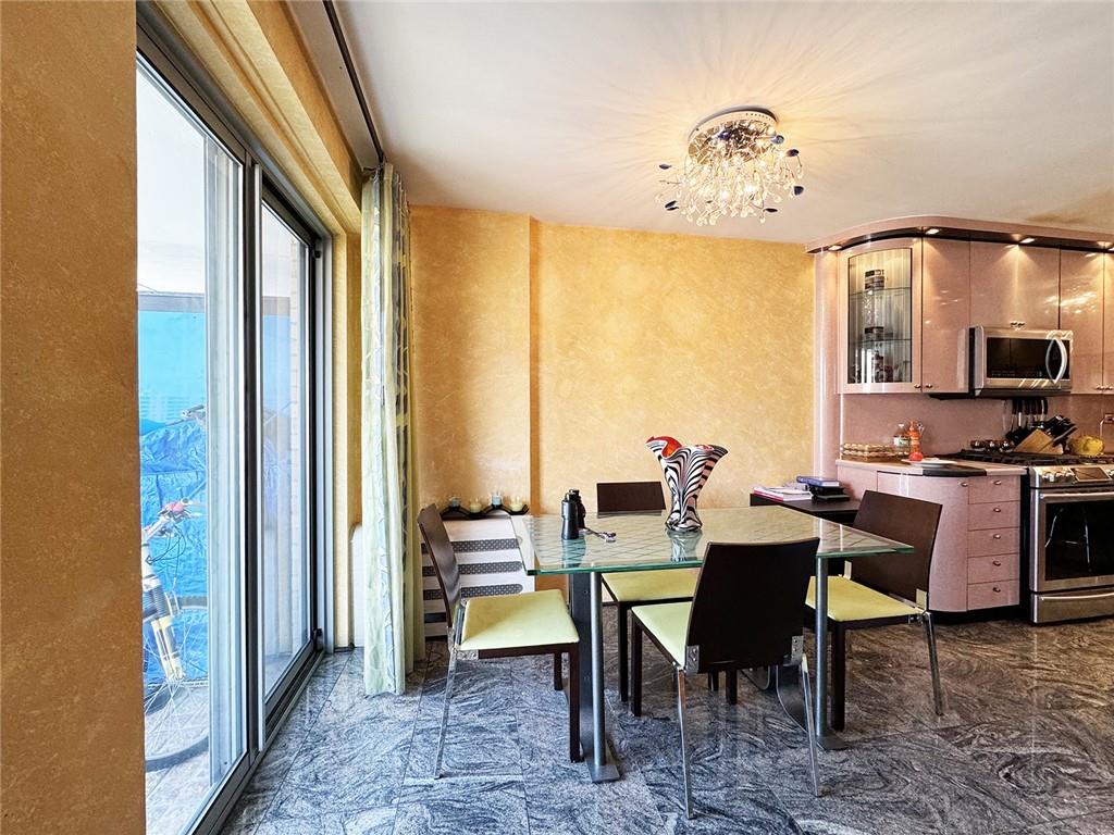 601 Surf Avenue, Unit 18E Brooklyn, NY 11224 - Photo 5 of 24 a dining room with furniture and wooden floor