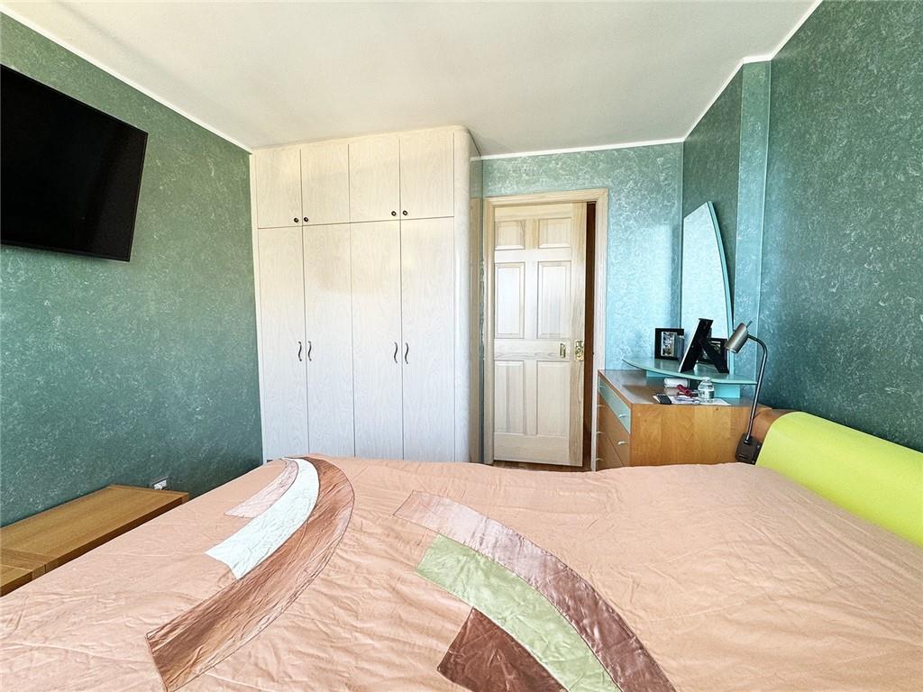 601 Surf Avenue, Unit 18E Brooklyn, NY 11224 - Photo 10 of 24 a bedroom with a bed and a flat screen tv