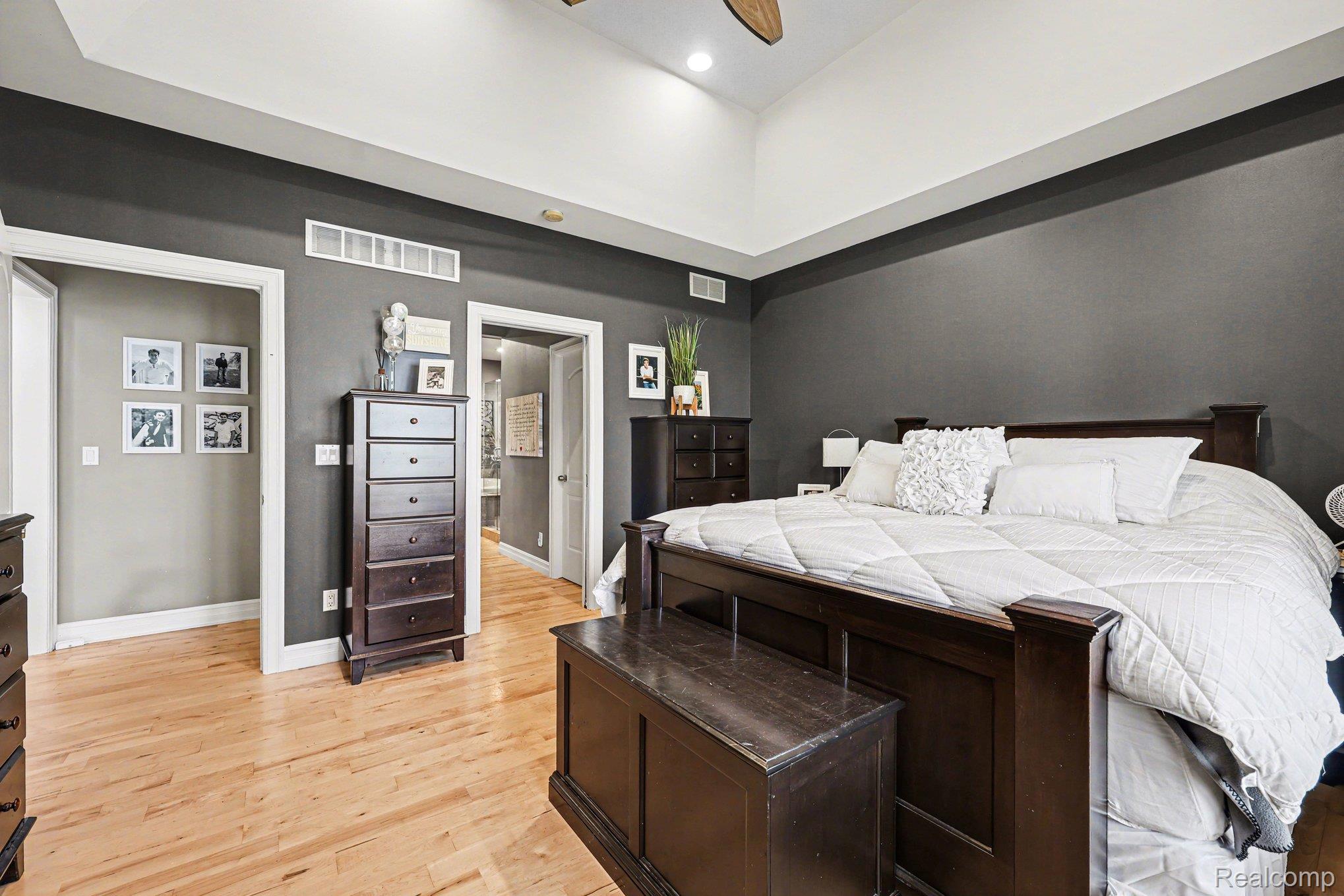 55256 Lee Road New Hudson, MI 48165 - Photo 15 of 28 Bedroom with a high ceiling, light wood finished floors, and recessed lighting