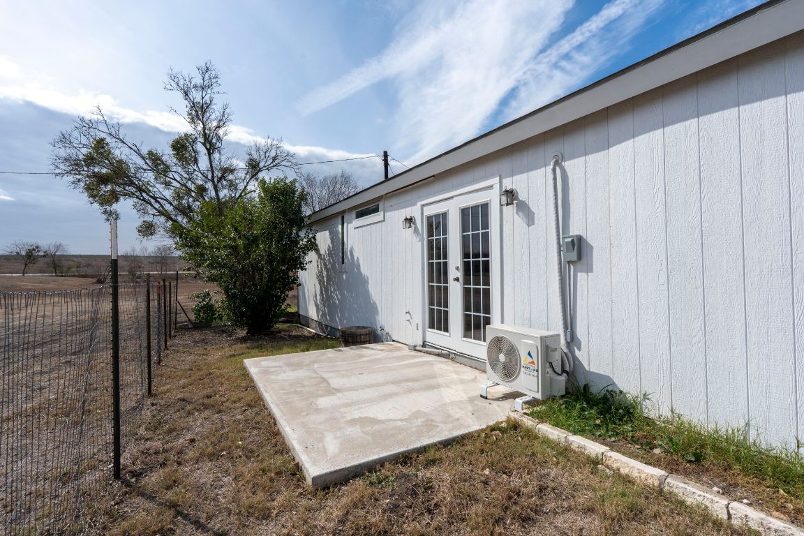13415 Crane Road Buda, TX 78610 - Photo 12 of 22 View of yard with french doors and a patio
