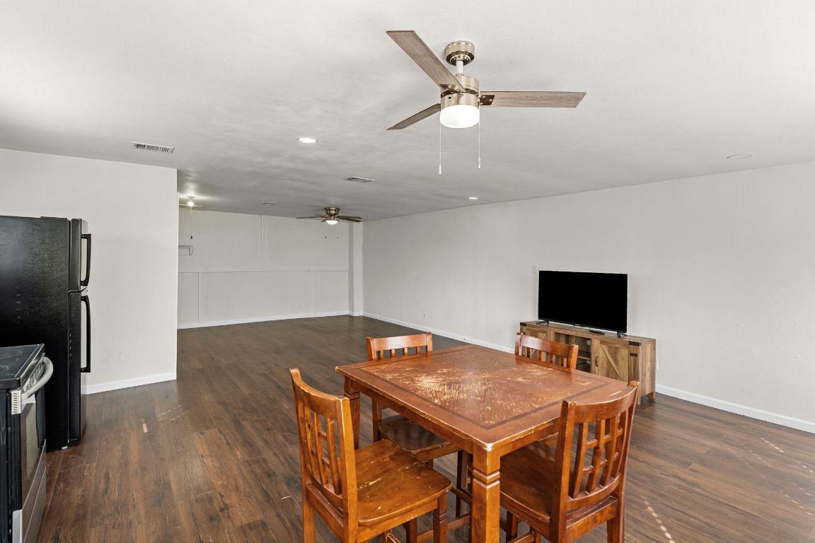 13415 Crane Road Buda, TX 78610 - Photo 18 of 22 Dining room with dark wood-type flooring and ceiling fan