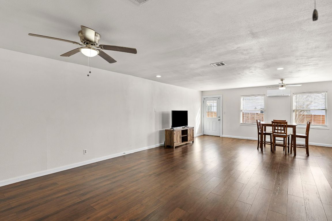 13415 Crane Road Buda, TX 78610 - Photo 19 of 22 Living room featuring ceiling fan, dark wood finished floors, and recessed lighting