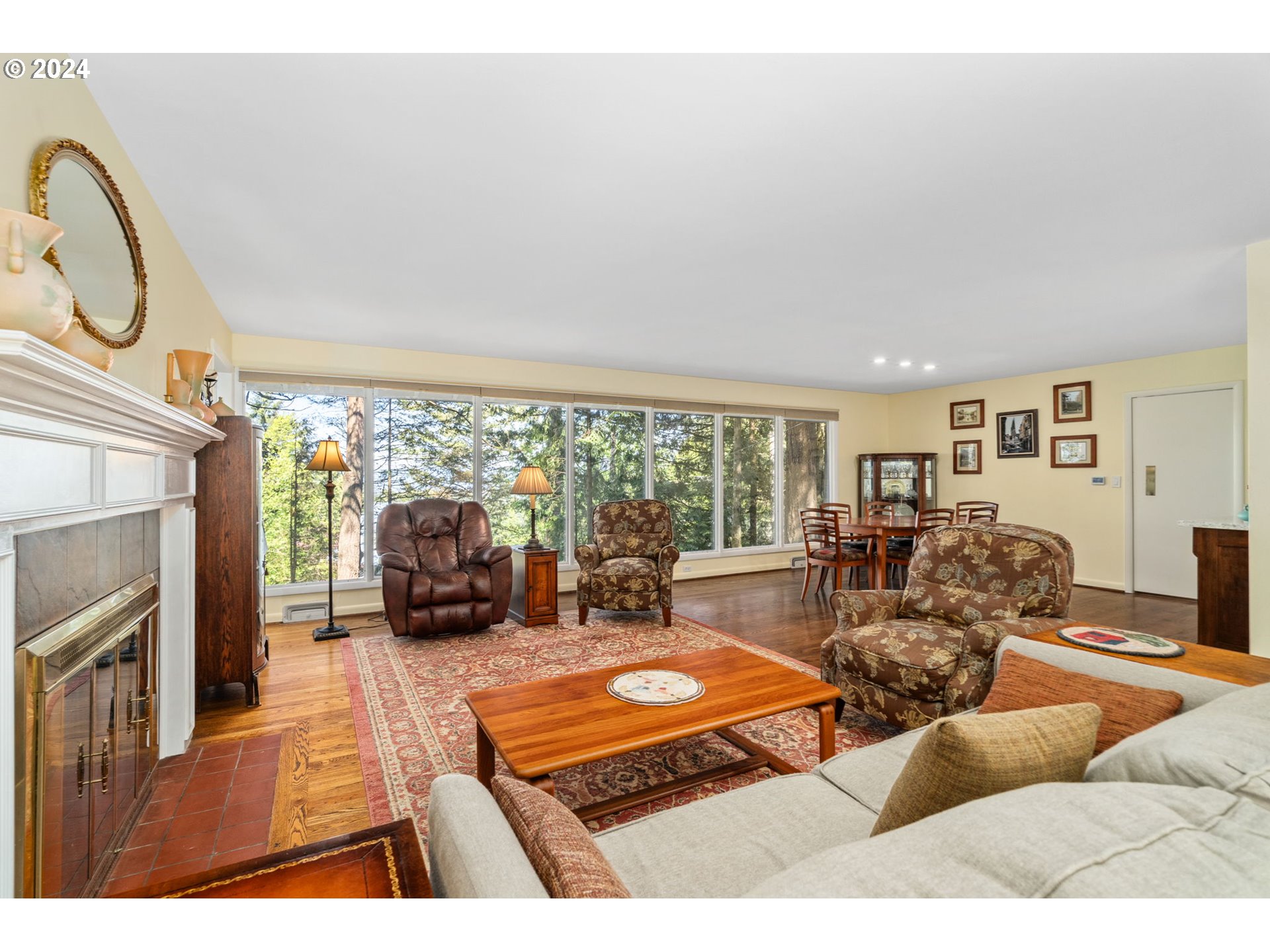 505 Northwest Greenleaf Road Portland, OR 97229 - Photo 24 of 44 a living room with furniture fireplace and a large window