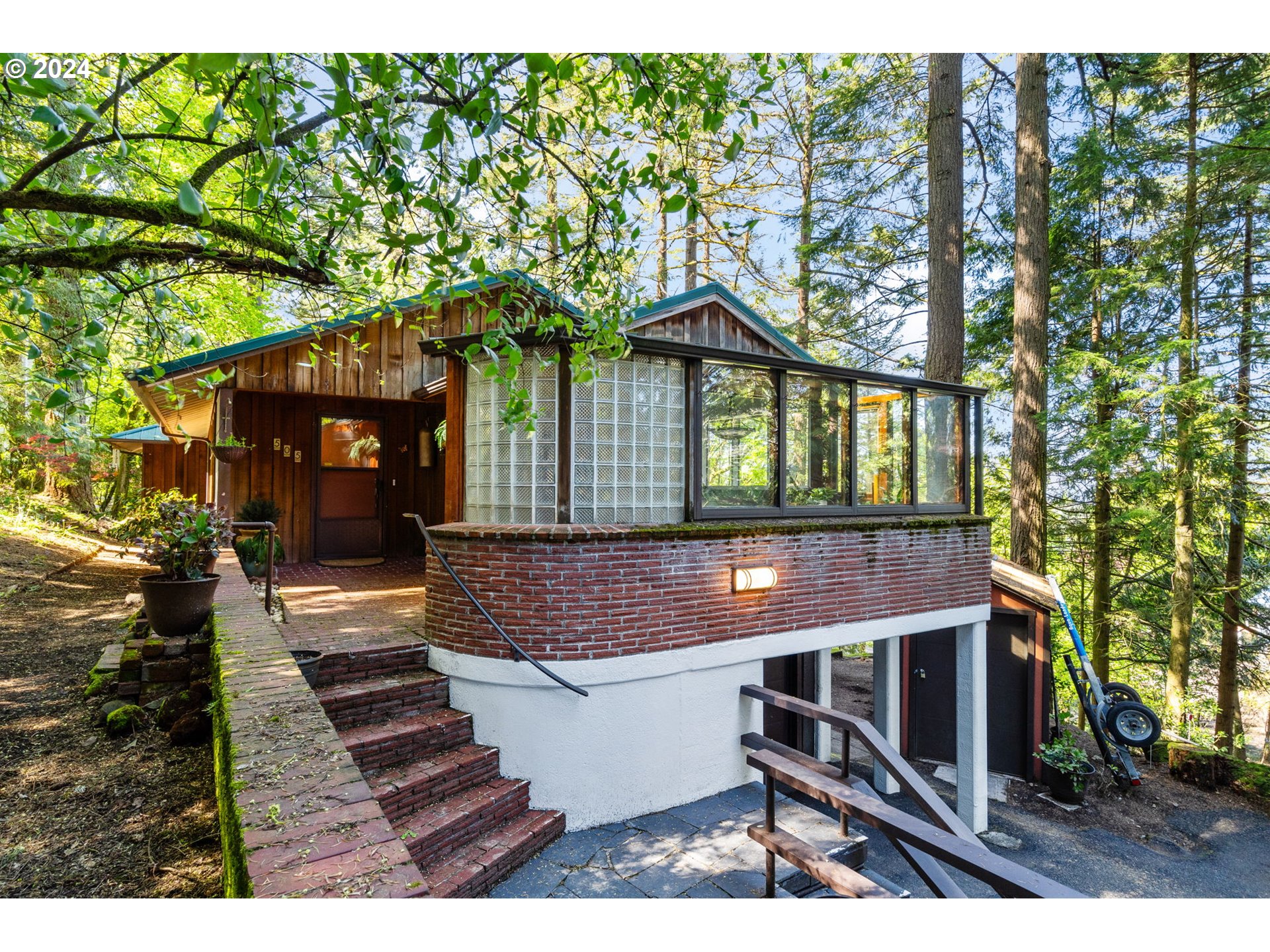 505 Northwest Greenleaf Road Portland, OR 97229 - Photo 7 of 44 a front view of a house with a porch