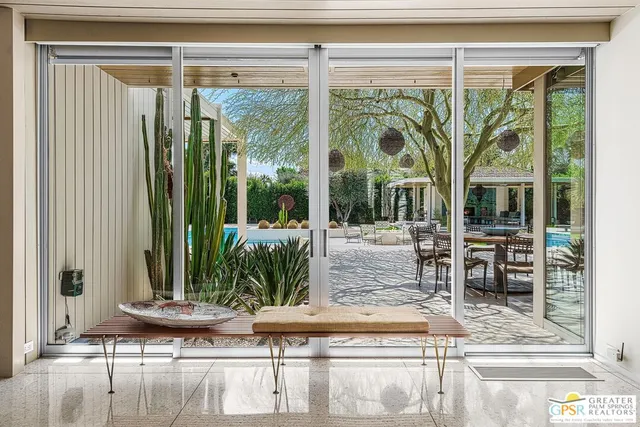 a view of a living room and workspace